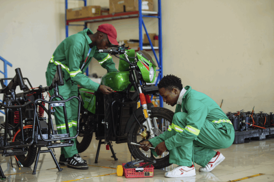 Engineers assembling ECOBODAA e-motocycle taxi with pay as you go system in Nairobi, Kenya
